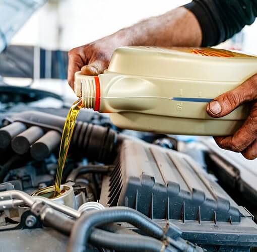 Pouring Oil To Car Engine